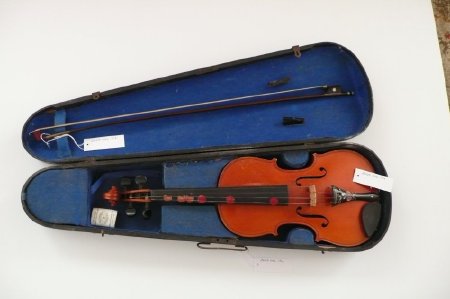 Violin in case with bow and resin container